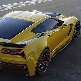 Corvette-Z06-C7.R-selber-fahren_3-Kopie.jpg Gelbe Corvette Z06 auf einer Rennstrecke