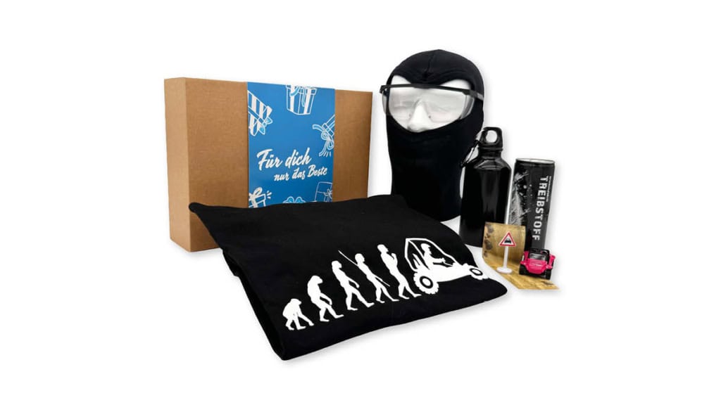 EF-Geschenkbox-Buggy Geschenkbox der Erlebnisfabrik für Buggy Erlebnisse mit blauer Banderole und passenden Inhalten.