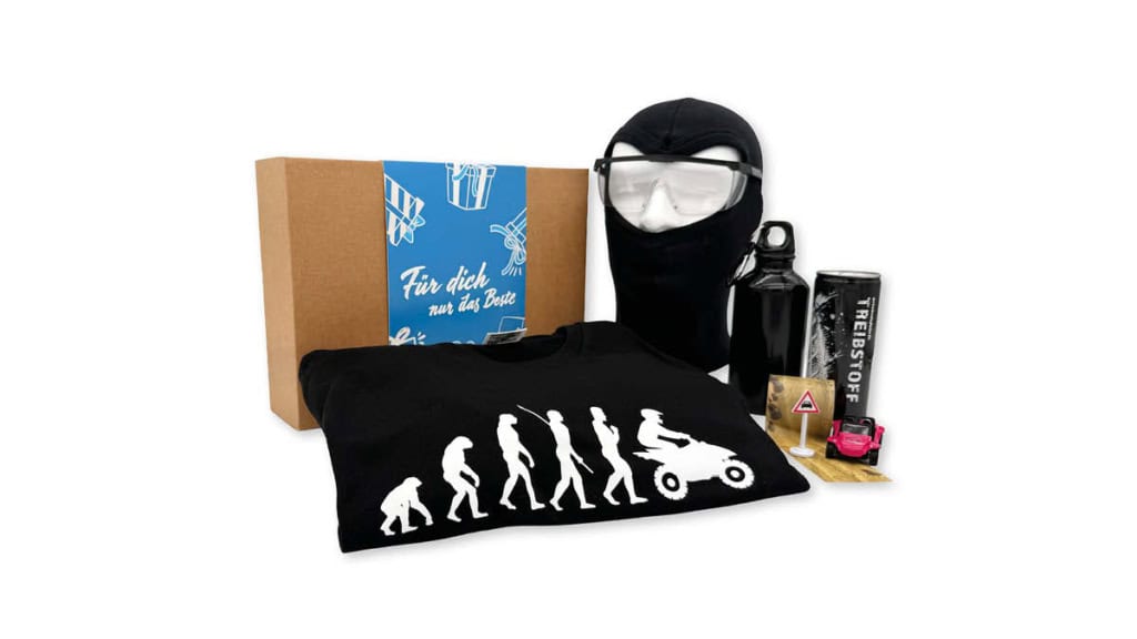 EF-Geschenkbox-Quad Geschenkbox der Erlebnisfabrik zu Quad Erlebnissen mit blauer Banderole.